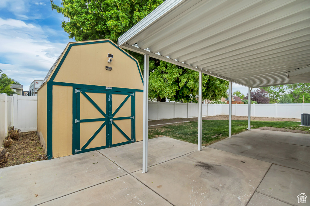 View of shed with a fenced backyard