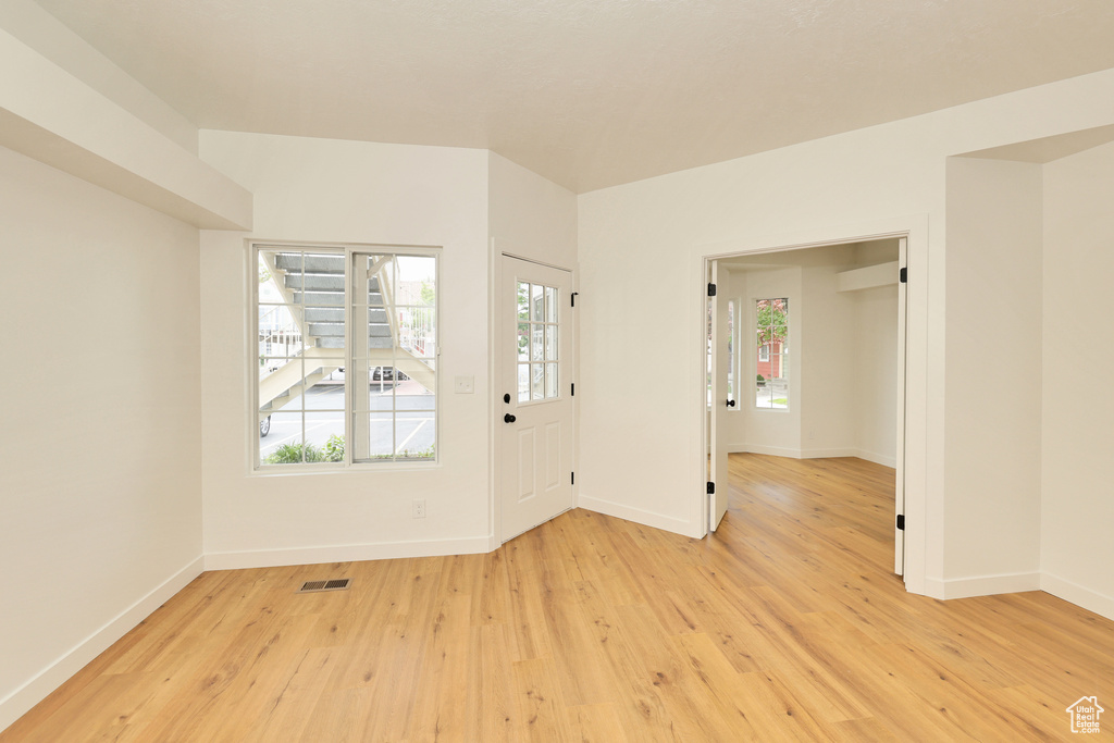 Entryway featuring light wood-type flooring and baseboards