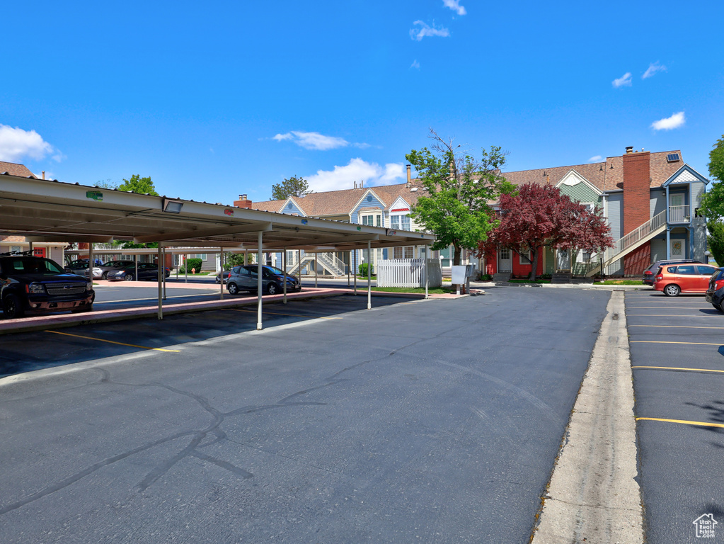 Partially covered parking lot with a residential view