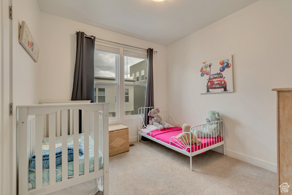 Bedroom with carpet and baseboards