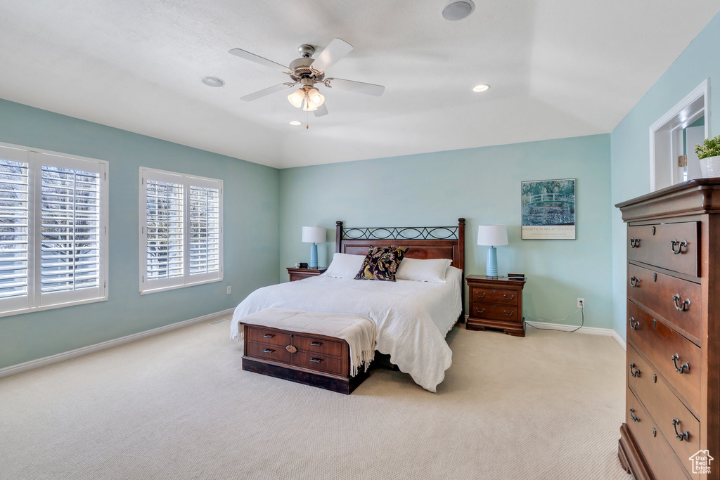 Bedroom featuring light carpet, baseboards, a ceiling fan, and recessed lighting
