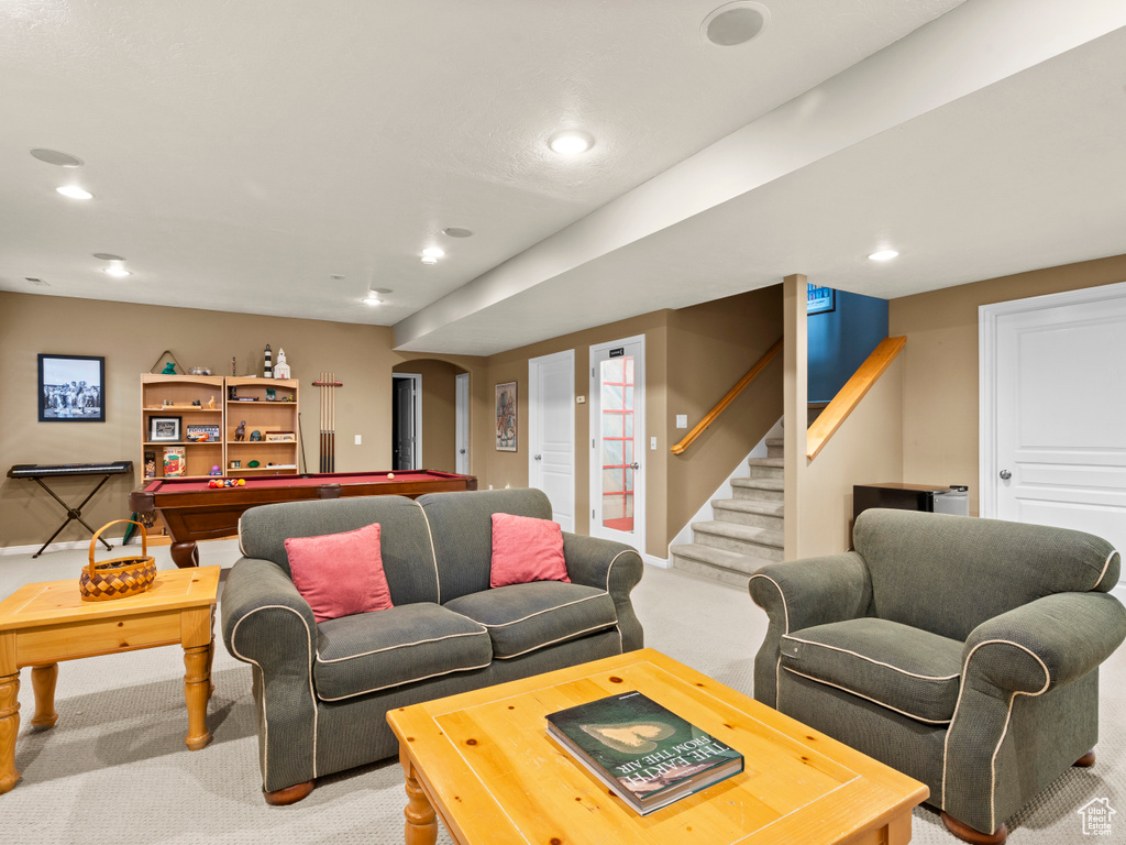Living area featuring carpet floors, billiards table, baseboards, recessed lighting, and stairs
