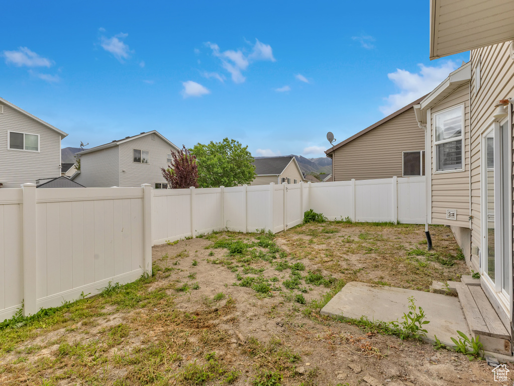 View of fenced backyard
