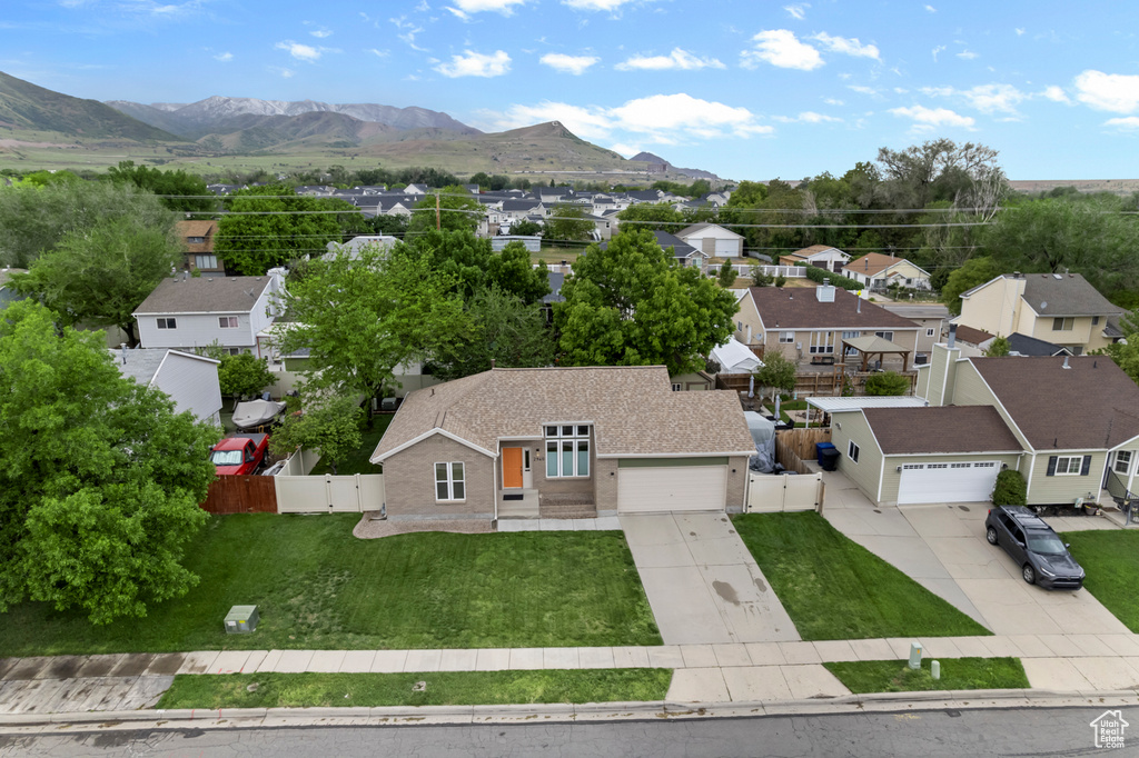 Aerial view of residential area featuring mountains