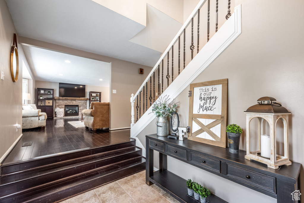 Stairs featuring a fireplace and recessed lighting