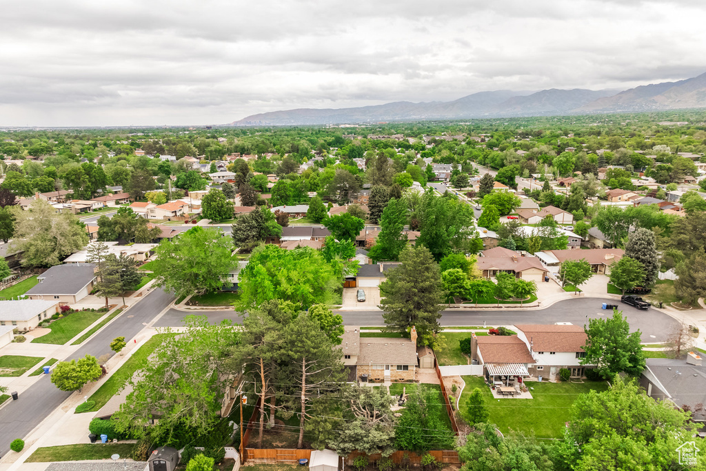 Aerial perspective of suburban area featuring a mountainous background