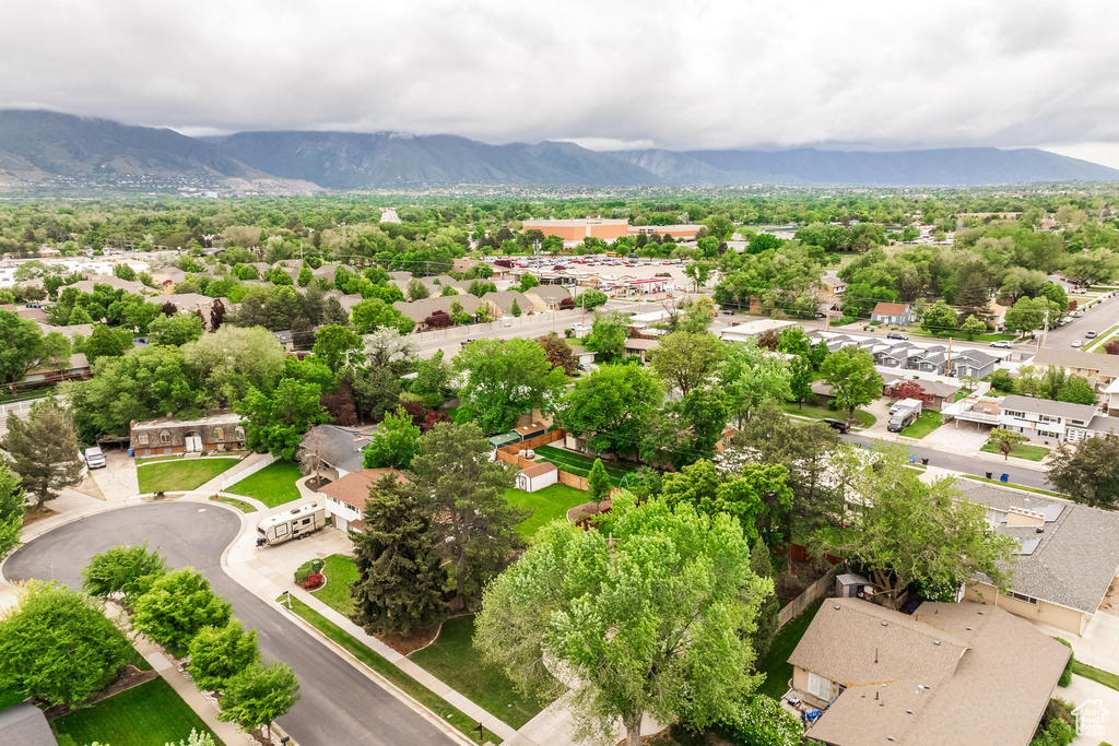 Aerial view of residential area featuring a mountain backdrop