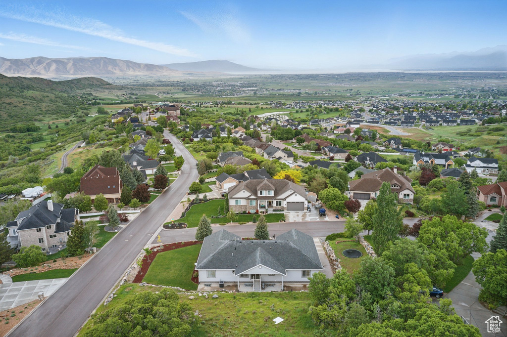 Aerial view of residential area featuring a mountain backdrop