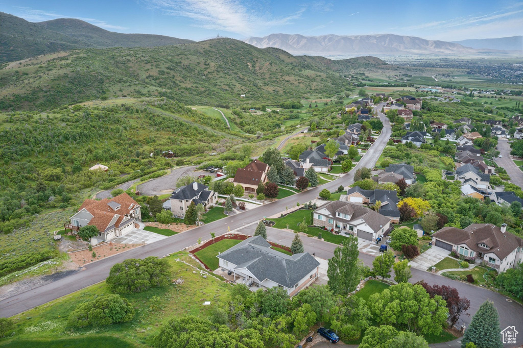 View of property location featuring nearby suburban area and a mountainous background