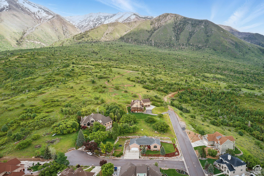 Aerial overview of property's location featuring a mountain backdrop
