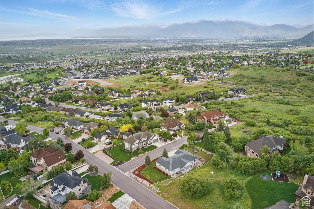 View of property location with mountains and nearby suburban area