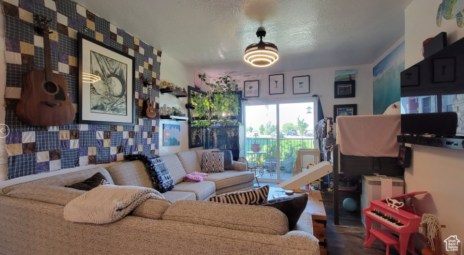Living area featuring a textured ceiling