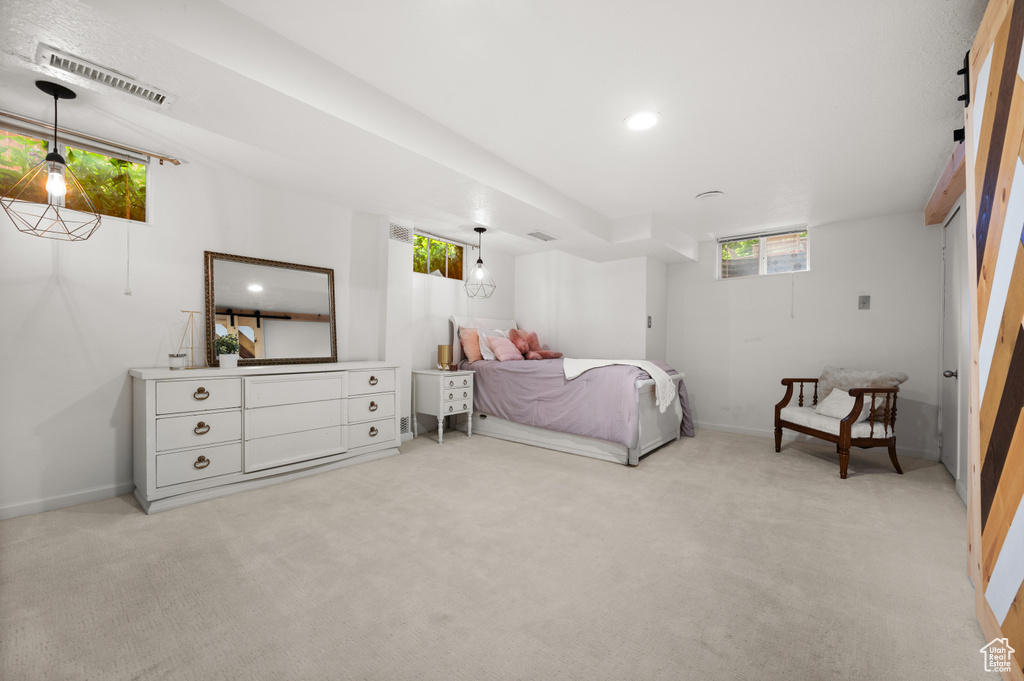 Bedroom featuring light carpet, baseboards, and recessed lighting