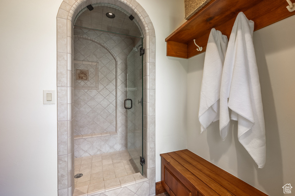 Full bathroom with a shower stall