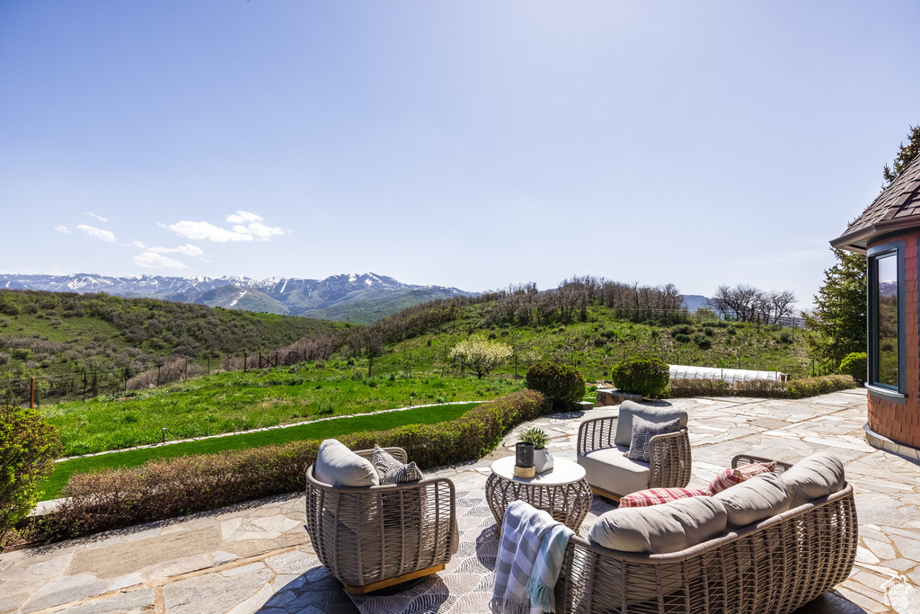 View of patio featuring outdoor lounge area and a mountain view