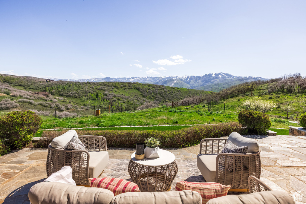View of patio / terrace featuring a mountain view and an outdoor living space