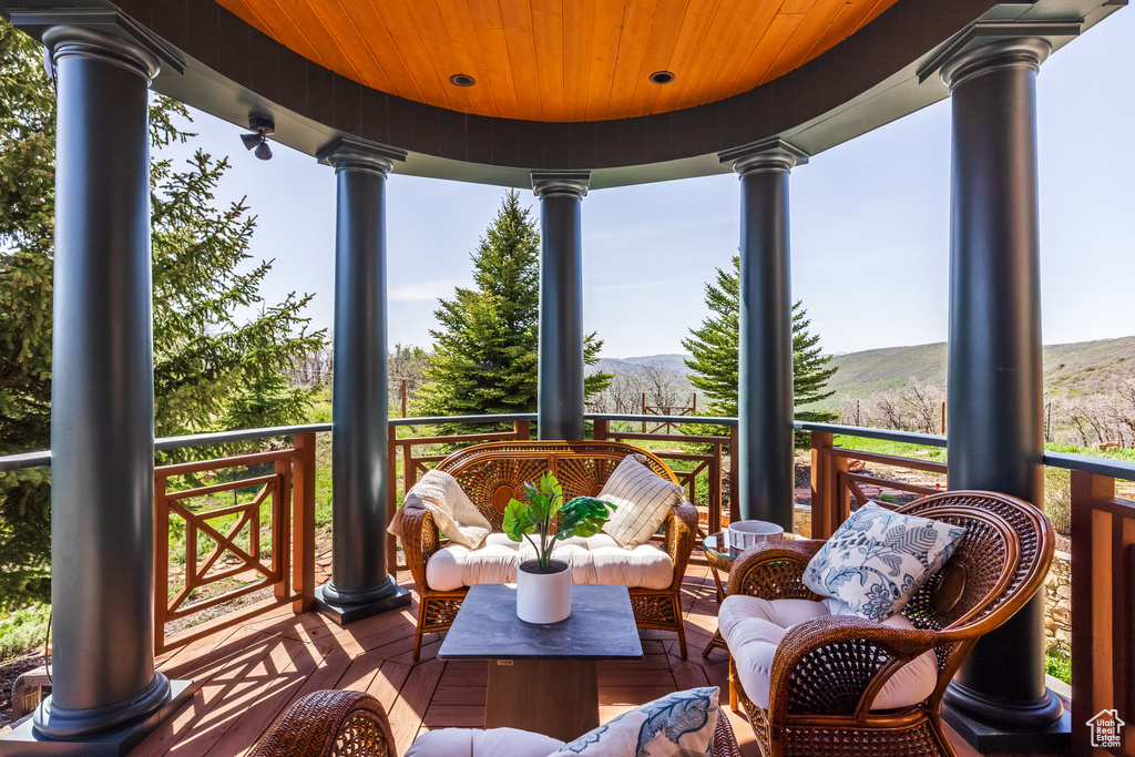 Wooden terrace featuring a mountain view