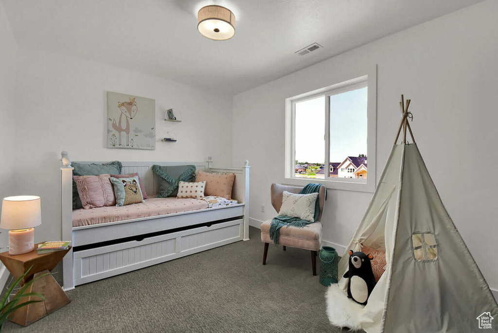 Bedroom with carpet floors and baseboards