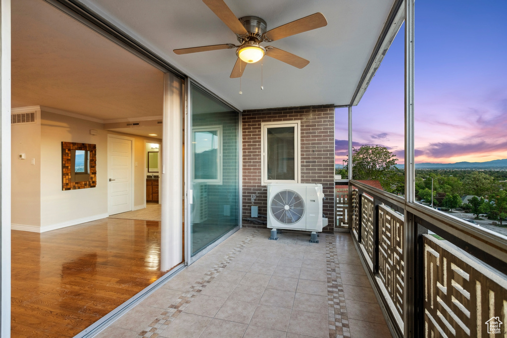 Balcony with a ceiling fan and a cooling unit