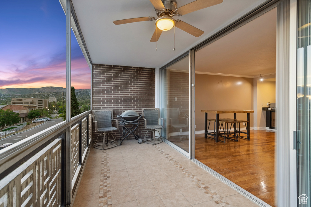Balcony featuring a ceiling fan