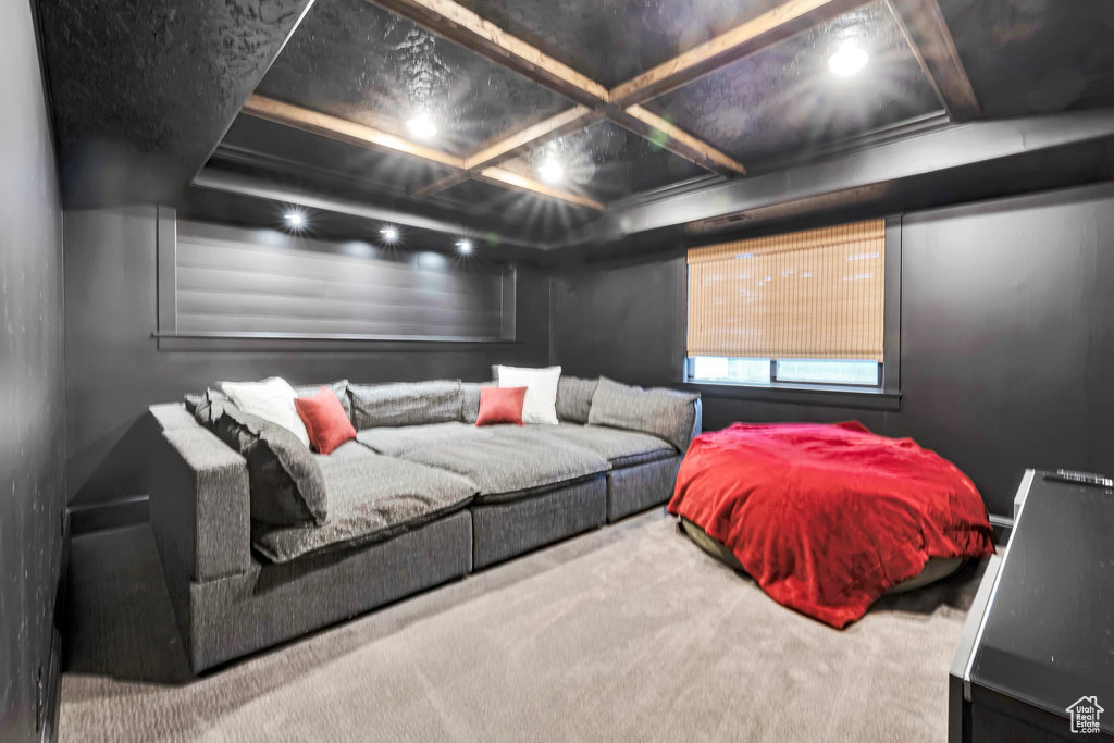 Cinema room featuring carpet and coffered ceiling