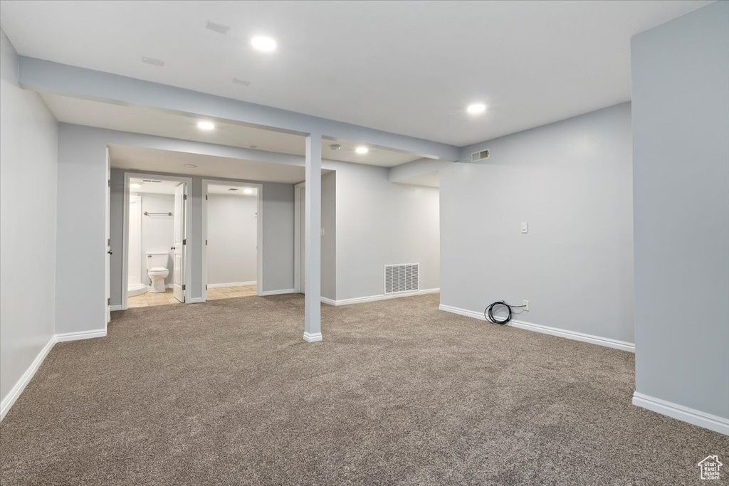Finished below grade area featuring carpet, recessed lighting, and baseboards