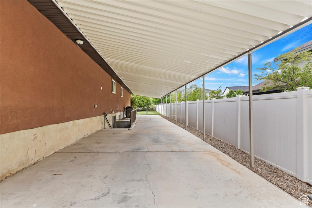 View of patio featuring a fenced backyard and a carport