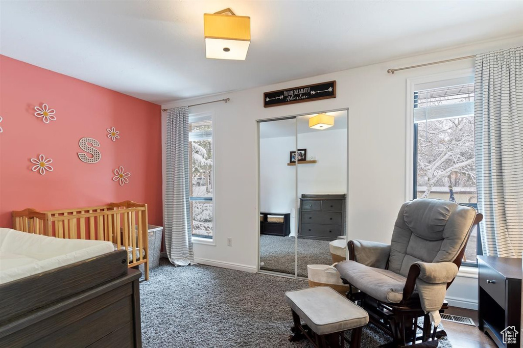 Bedroom with a closet, carpet floors, and baseboards