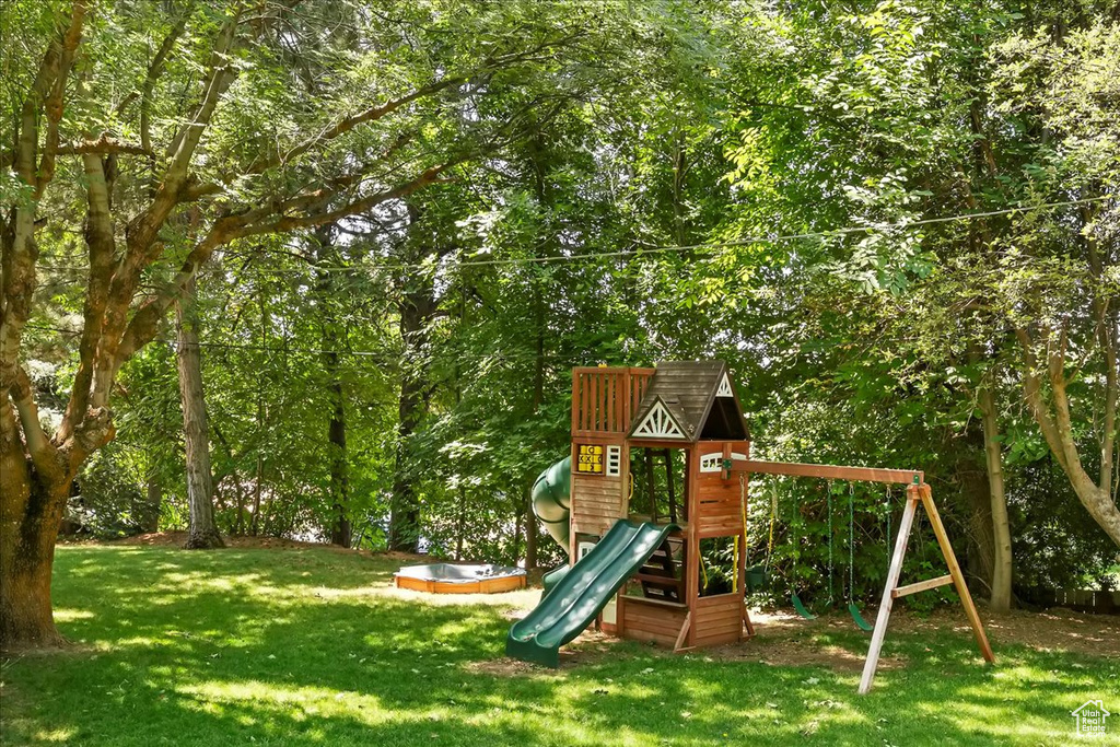 View of play area featuring a yard