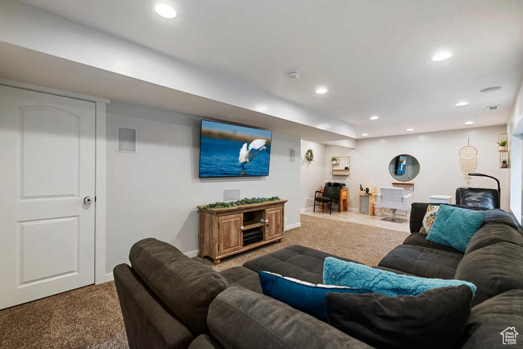 Living area featuring carpet, recessed lighting, and baseboards