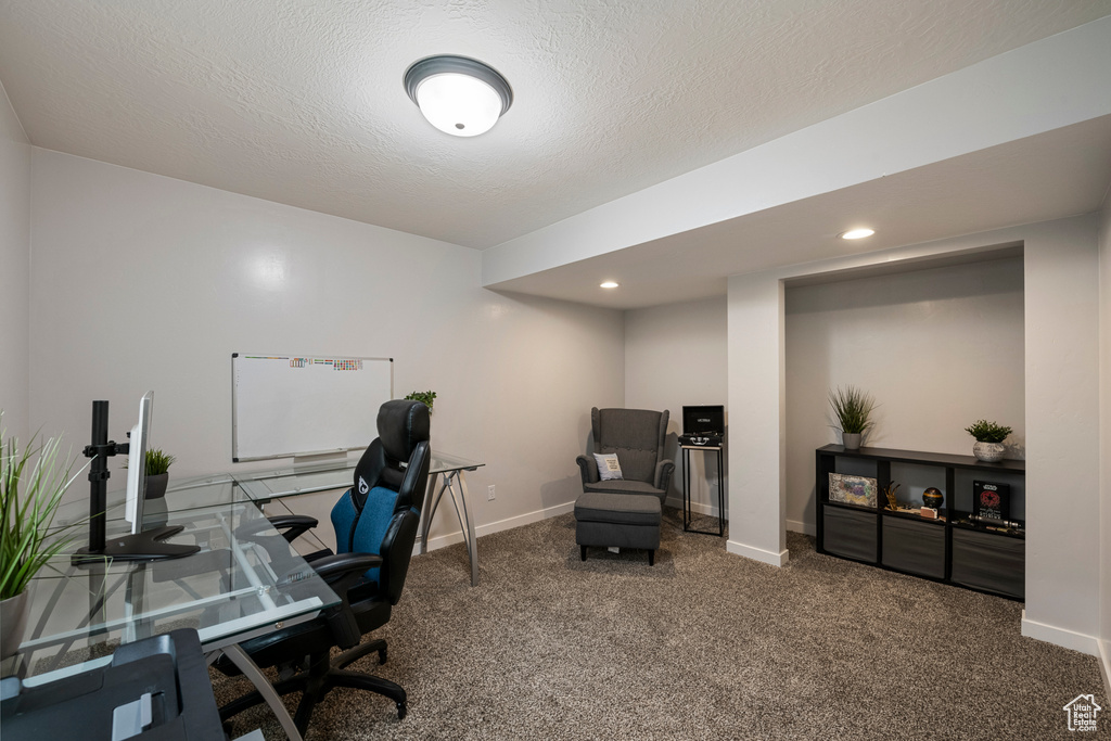Carpeted office with baseboards and recessed lighting