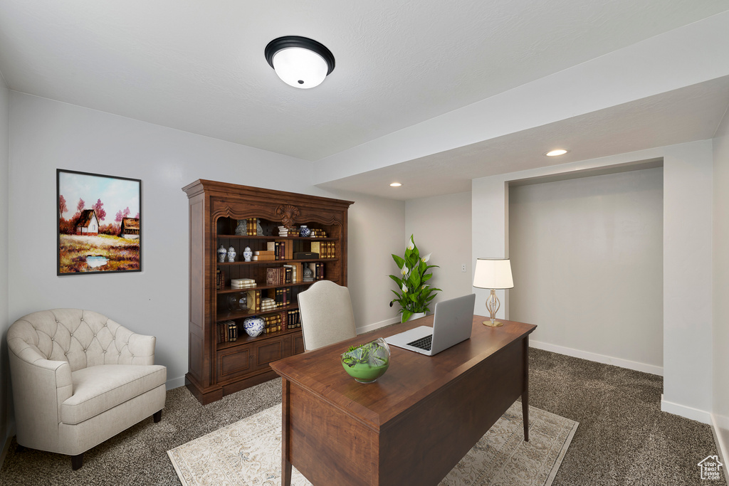 Carpeted office space featuring baseboards and recessed lighting