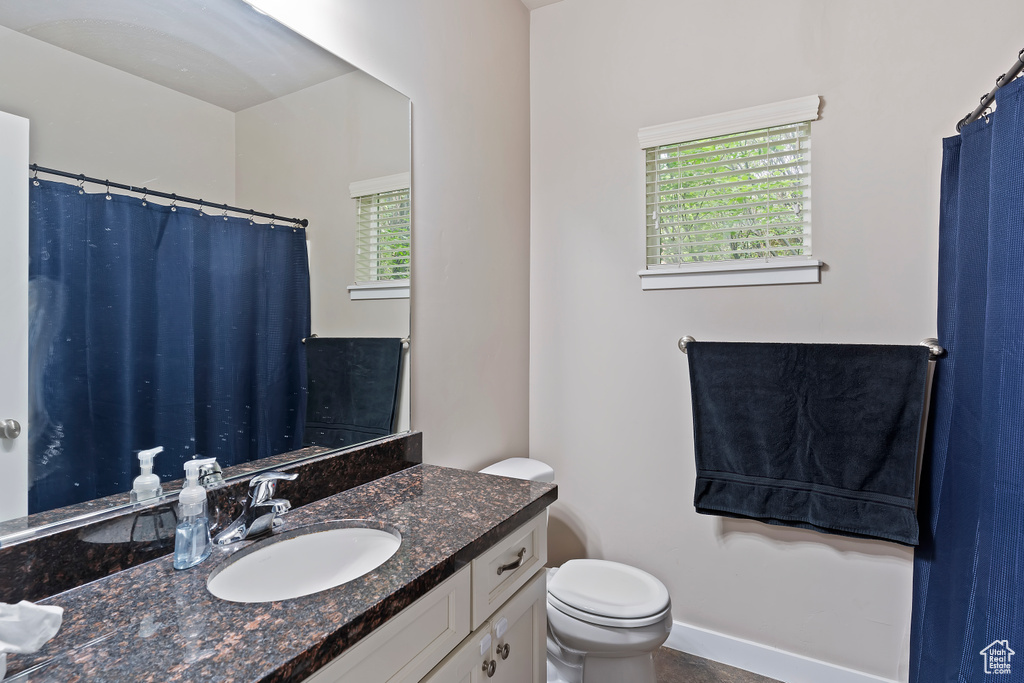 Bathroom with vanity and toilet