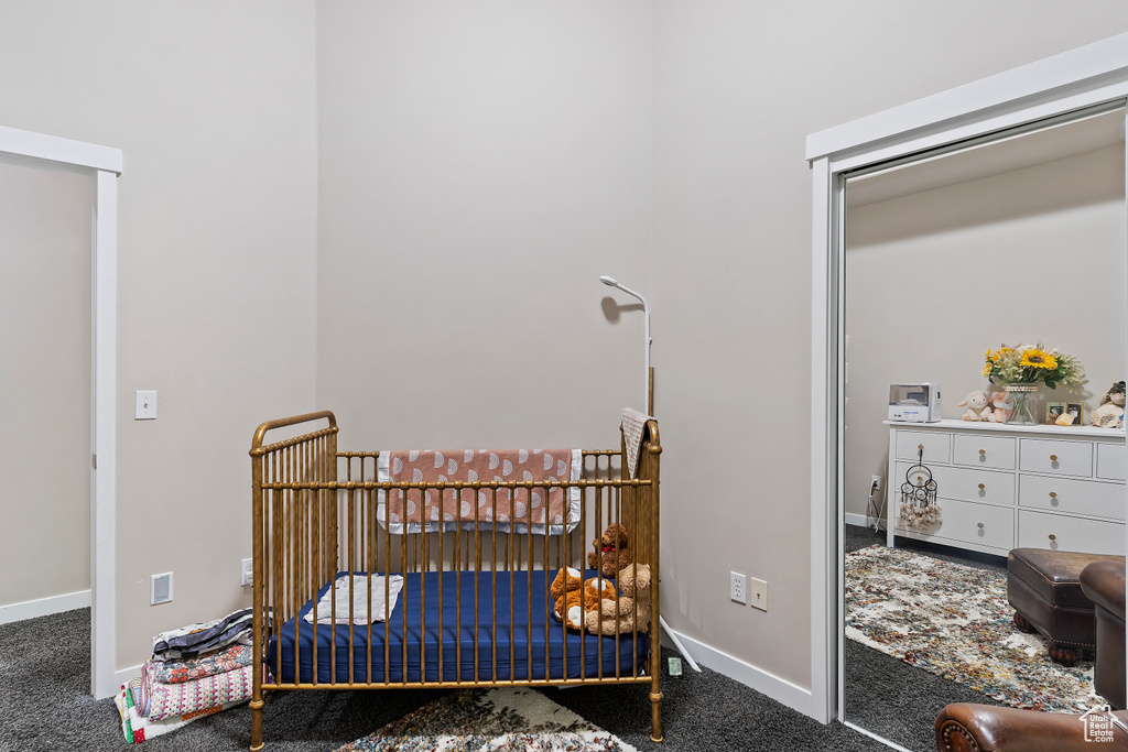 Carpeted bedroom featuring baseboards