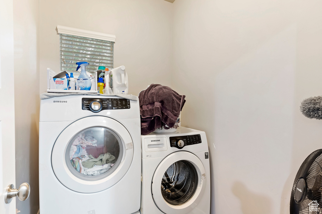 Clothes washing area with washer and clothes dryer