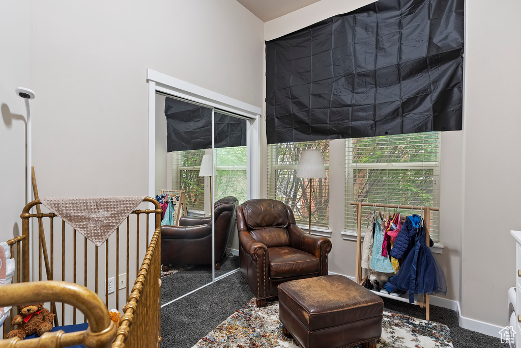 Living area with carpet and baseboards