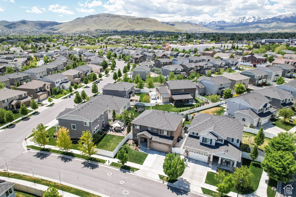 Aerial view of residential area featuring a mountain backdrop