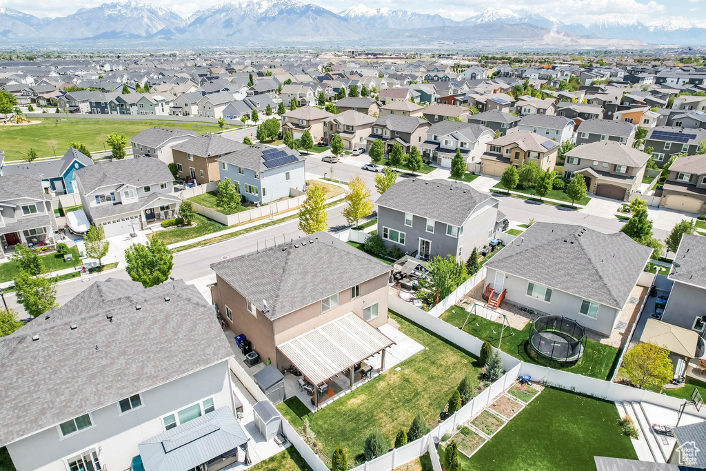 Aerial view of residential area with a mountainous background