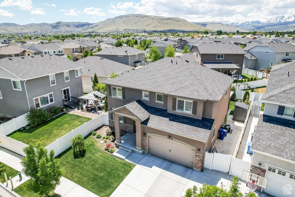 Aerial view of residential area with a mountainous background