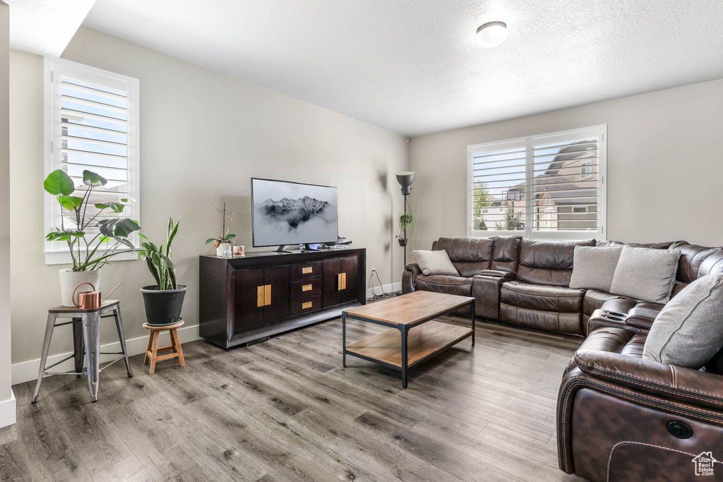 Living room with wood finished floors and baseboards