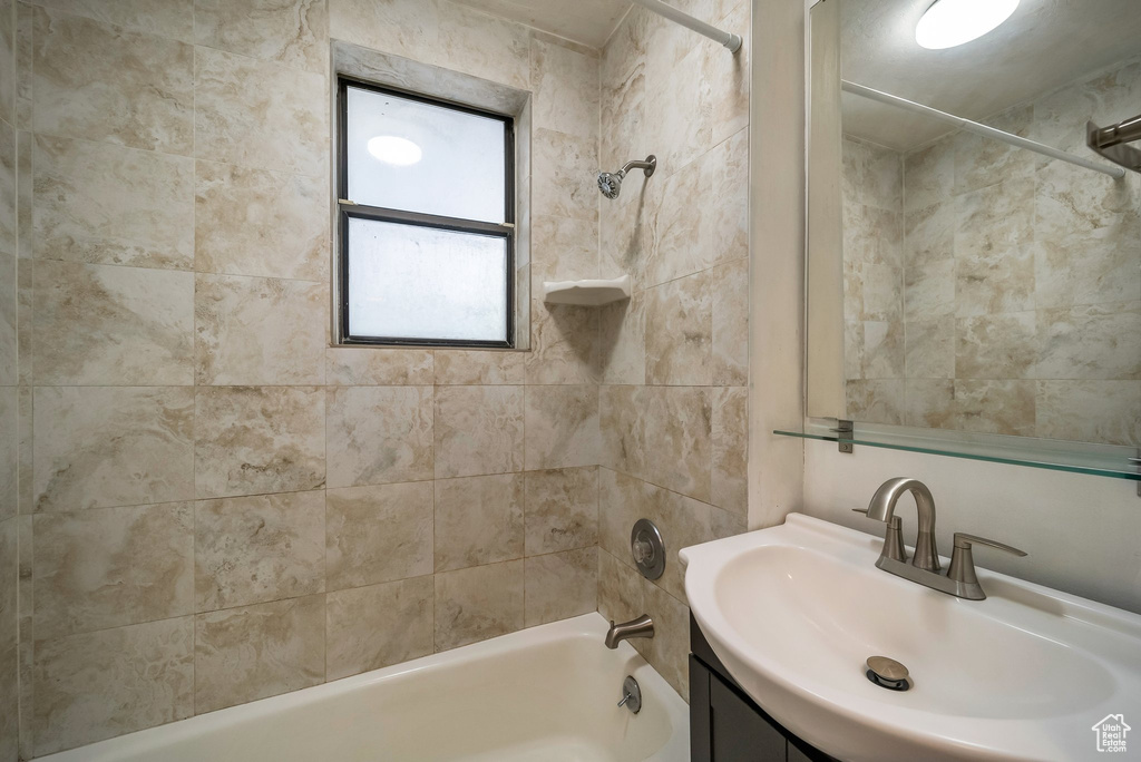 Full bath featuring shower / bath combination and vanity