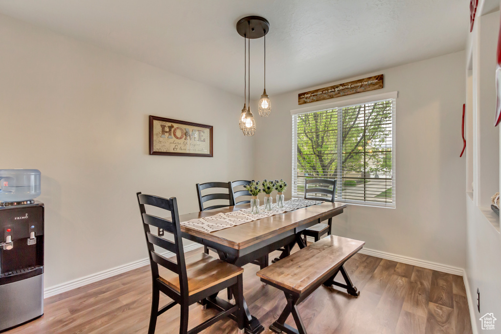 Dining area featuring wood finished floors and baseboards