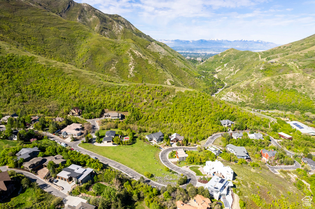 Aerial view of residential area featuring a mountain backdrop