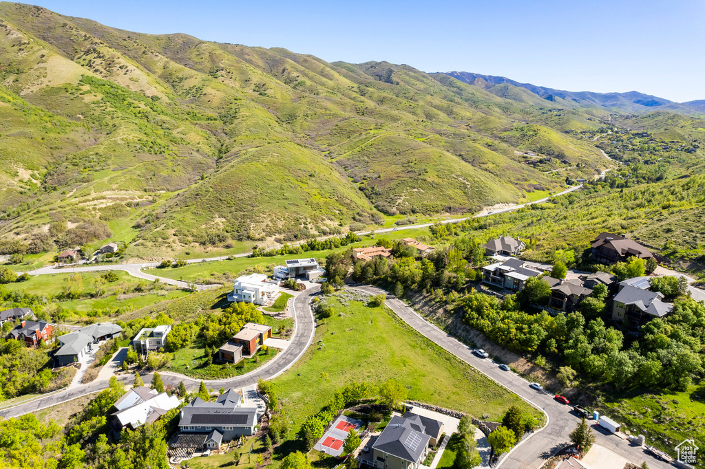 Aerial perspective of suburban area featuring a mountainous background