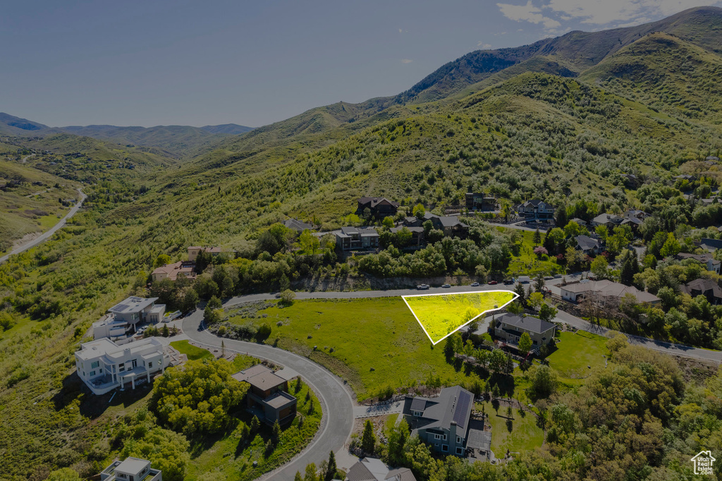 Aerial overview of property's location featuring property boundaries highlighted and mountains