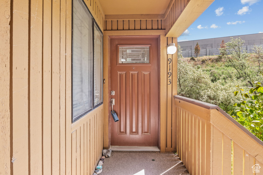 Property entrance featuring a balcony