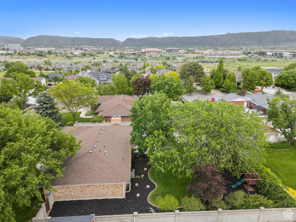 Aerial perspective of suburban area featuring a mountain backdrop