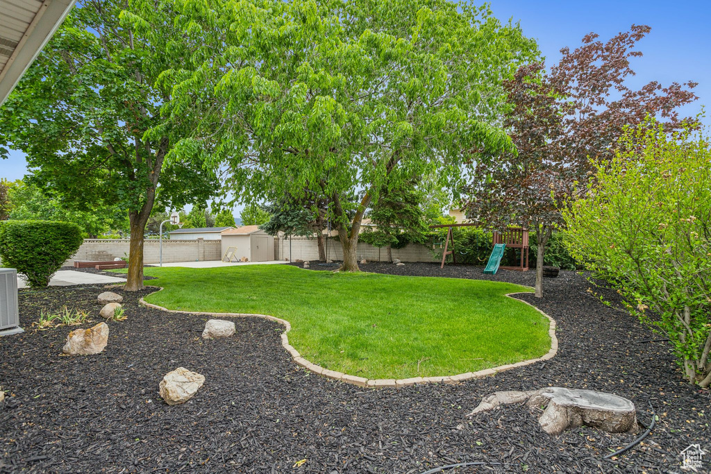 View of yard featuring a playground