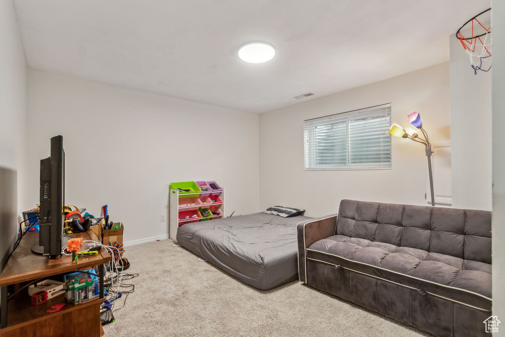 Carpeted living room featuring baseboards