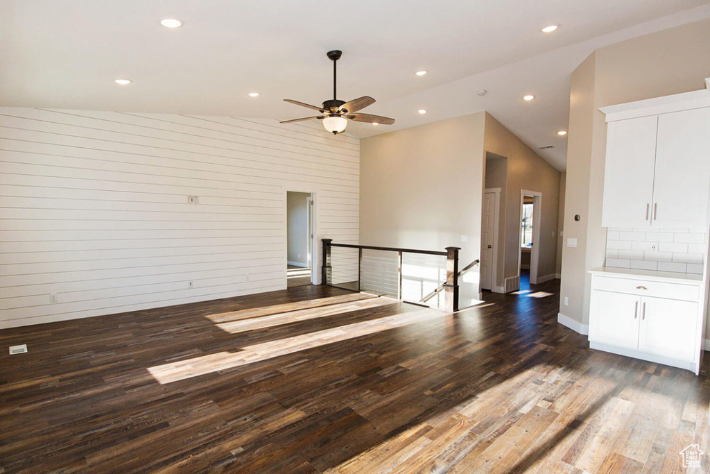 Unfurnished room with wood finished floors, ceiling fan, and recessed lighting